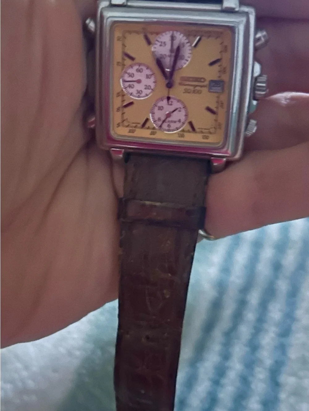 Seiko SQ 100 vintage watch with brown leather band